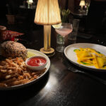 The Maker Burger, white cheddar, pickles, black truffle aioli, fries Osso bucco ravioli